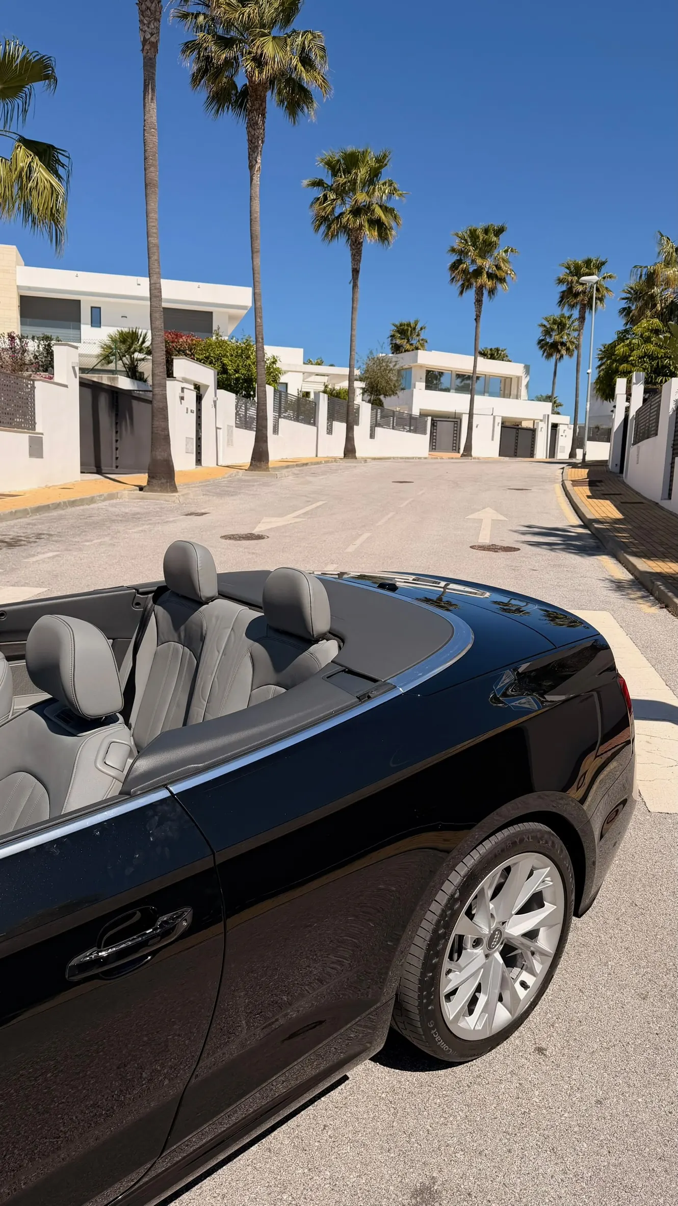 Top-down view of the Audi A5 Convertible's 4-seat Rotor Grey leather interior with Marbella street perspective
