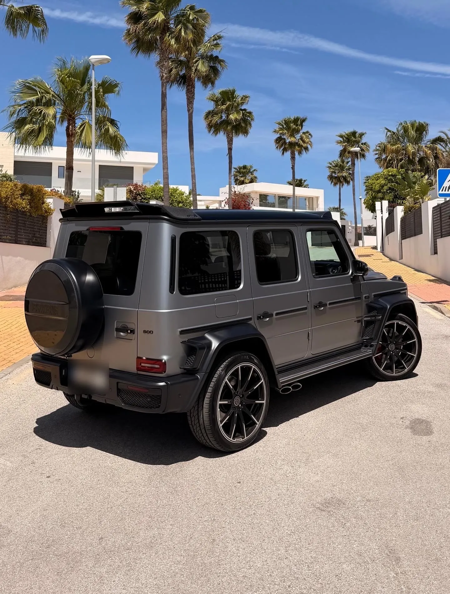 Mercedes-AMG G63 Brabus 800 rear three-quarter view with Brabus Monoblock wheels and carbon spoiler