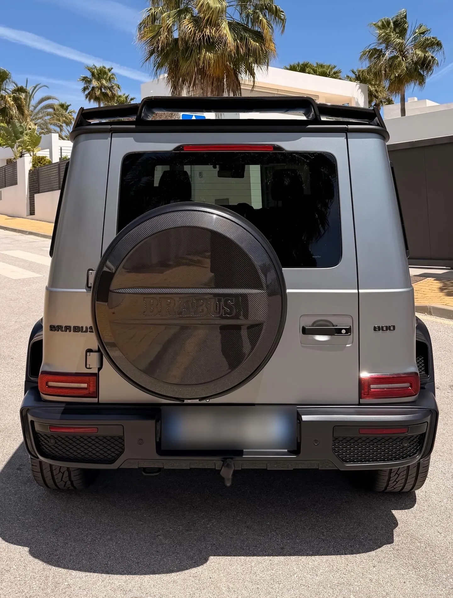 Rear view of G63 Brabus with BRABUS-signed carbon fiber spare wheel cover