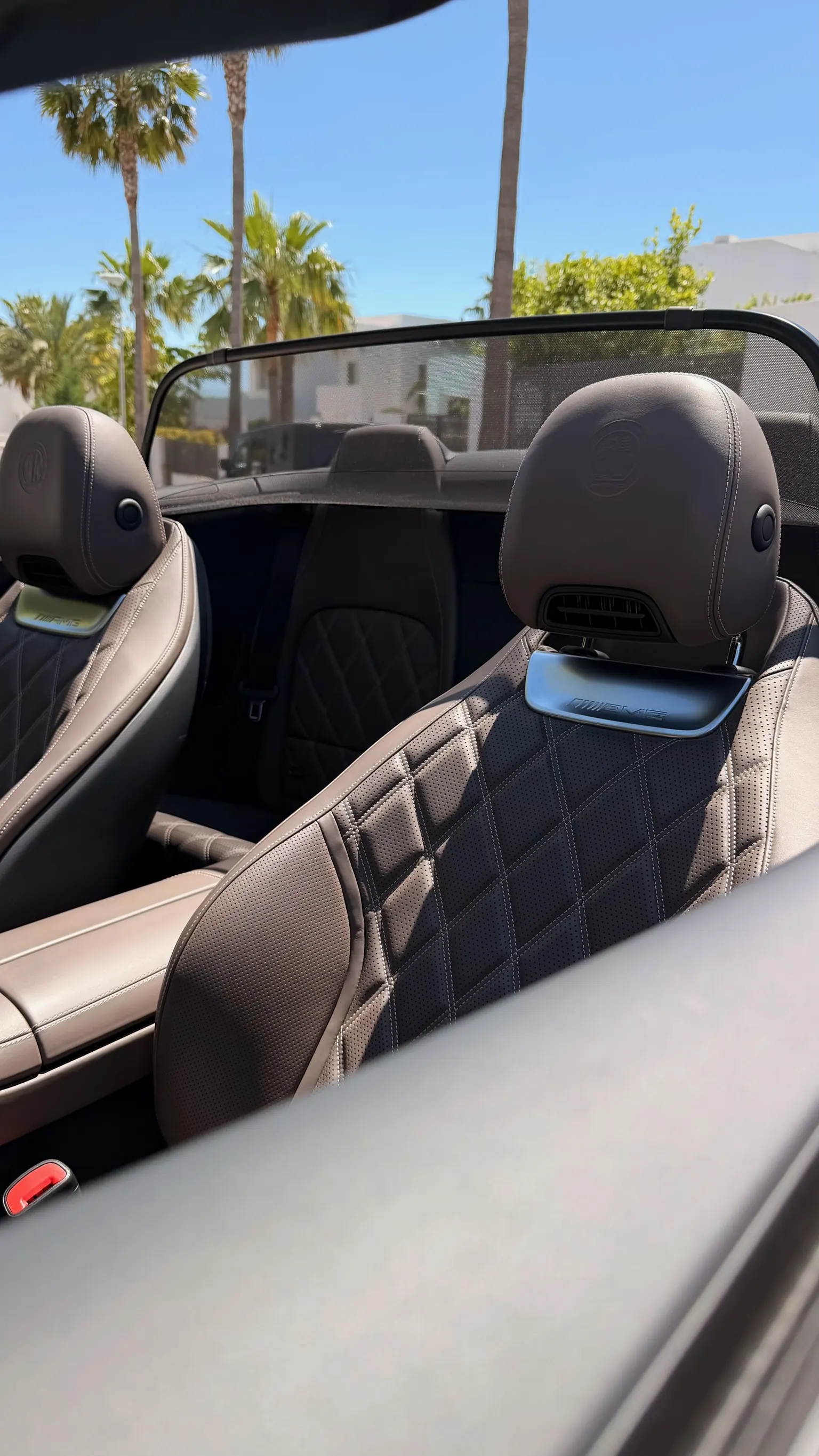 Mercedes-AMG SL 55 seats in two-tone espresso and macchiato Nappa leather with diamond quilting, AMG star embossed on headrests and integrated AIRSCARF